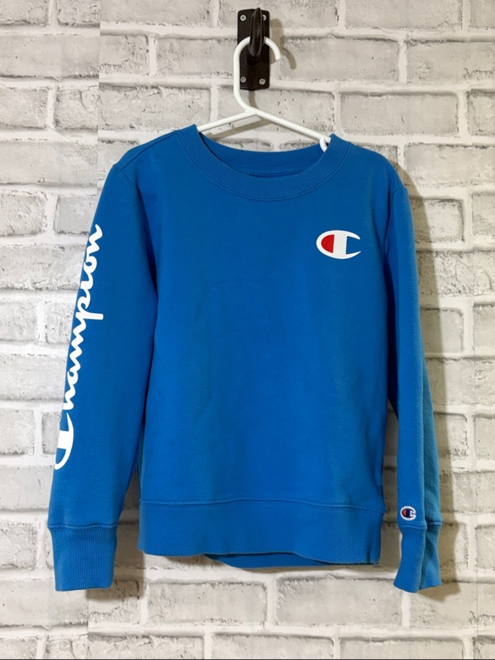 Champion Blue Crewneck Sweatshirt with White Tag and Red Accent size 6